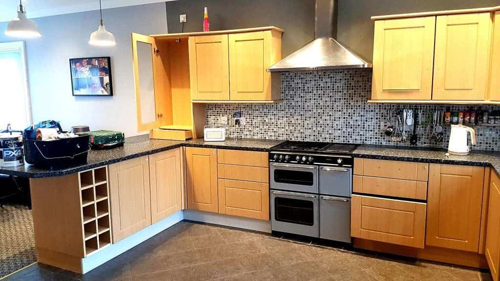 Modern kitchen with wooden cabinets and appliances