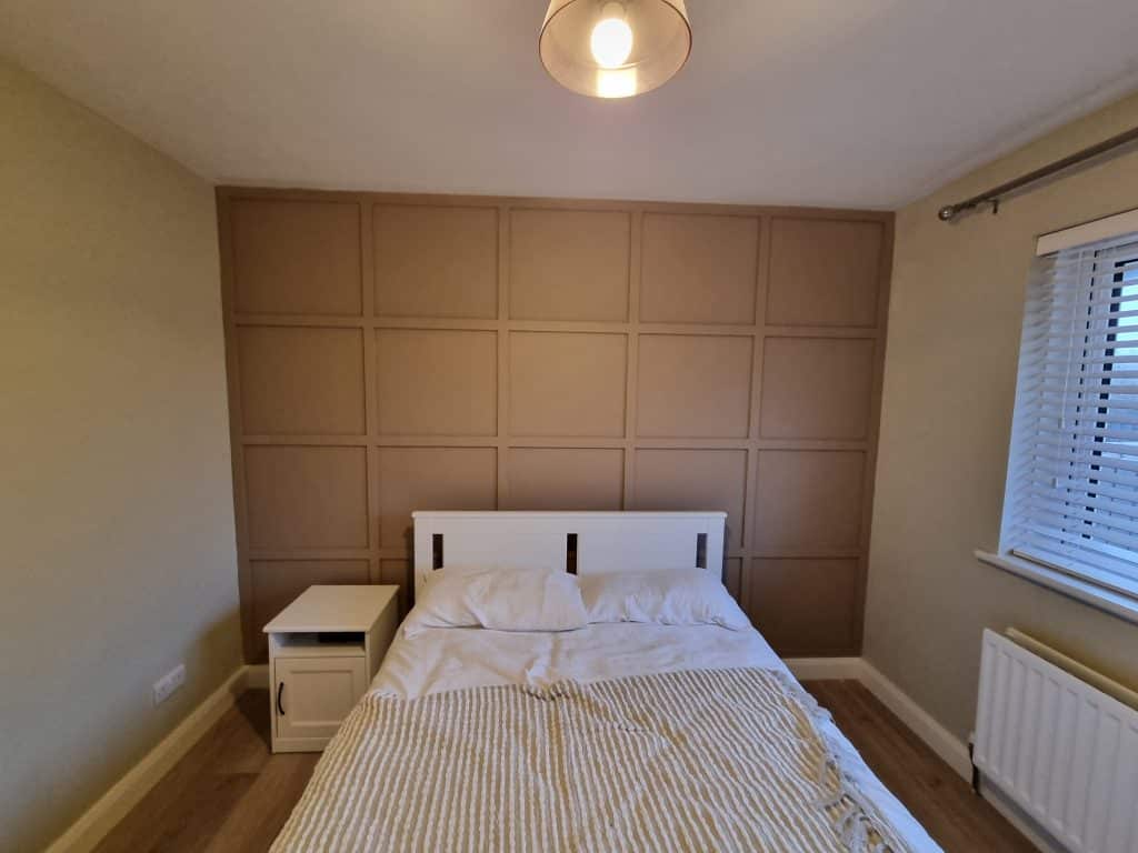 bedroom with wall paneling in portstewart